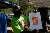 Title: Abe Muriati with his first etching  pruduced at Djumbunji Press, Laura Dance Festival, Laura, Queensland.