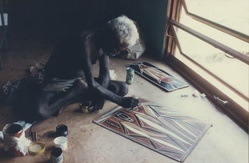 Artist: Tremblay, Theo. | Title: David Malangie painting on a lino for the print 'Creatures of Yathalamarra [Night creatures of my country]', Theo Trenblay print workshop, Ramingining, April 1997. | Date: April 1997