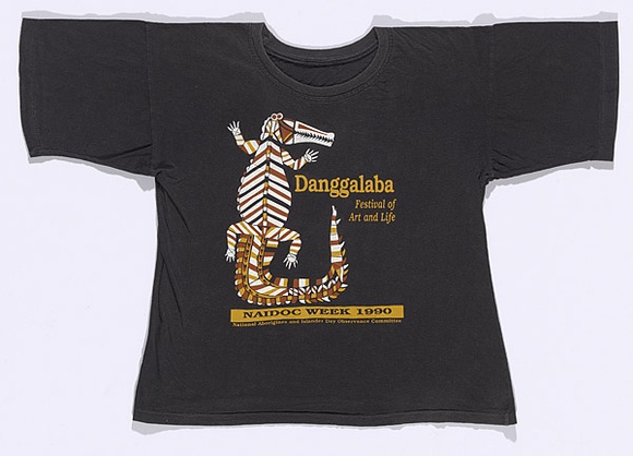 Artist: b'Territory Track and Field.' | Title: b'T-shirt: Danggalaba - Festival of Art and Life.' | Date: 1990 | Technique: b'screenprint, printed in colour, from multiple stencils' Artist: b'Territory Track and Field.' | Title: b'T-shirt: Danggalaba - Festival of Art and Life.' | Date: 1990 | Technique: b'screenprint, printed in colour, from multiple stencils'