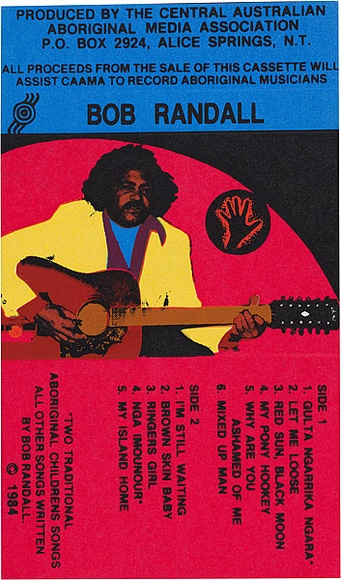 Artist: b'REDBACK GRAPHIX' | Title: b'Cassette cover: Bob Randall' | Date: 1984 | Technique: b'screenprint, printed in colour, from four stencils' Artist: b'REDBACK GRAPHIX' | Title: b'Cassette cover: Bob Randall' | Date: 1984 | Technique: b'screenprint, printed in colour, from four stencils'