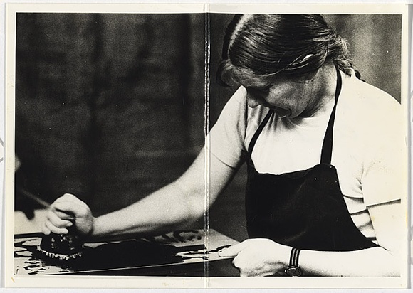 Title: b'ANU Christmas card, inking a plate' | Date: 1976 | Technique: b'gelatin-silver print; handwritten inscription in black and blue ink'