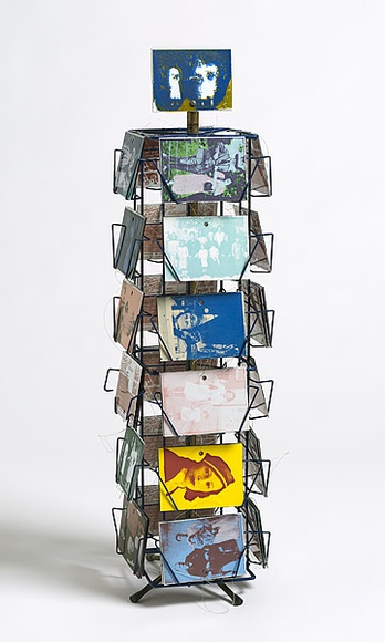 Artist: b'VIVIENNE BINNS AND PARTICIPANTS' | Title: bMothers' memories, others' memories: postcard rack. | Date: 1980 | Technique: b'photo-screenprint, printed in colour vitreous enamels, from multiple stencils; nylon line; anodised steel' | Copyright: b'\xc2\xa9 Vivienne Binns' Artist: b'VIVIENNE BINNS AND PARTICIPANTS' | Title: bMothers' memories, others' memories: postcard rack. | Date: 1980 | Technique: b'photo-screenprint, printed in colour vitreous enamels, from multiple stencils; nylon line; anodised steel' | Copyright: b'\xc2\xa9 Vivienne Binns'