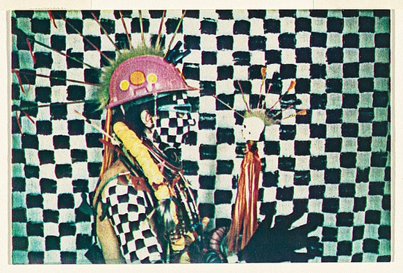 Artist: McDiarmid, David. | Title: not titled [Afro-American holding plastic flower]: postcard from the series Urban Tribalwear. | Date: (1980) | Technique: photocopy, printed in colour | Copyright: Courtesy of copyright owner, Merlene Gibson (sister)